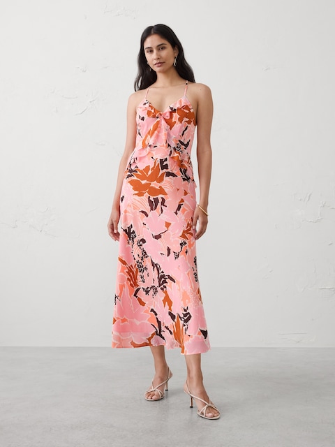 ROBE MI-LONGUE EN MOUSSELINE COUPÉE EN BIAIS À VOLANTS
